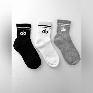 ALO yoga trio crew socks in black, white, and gray